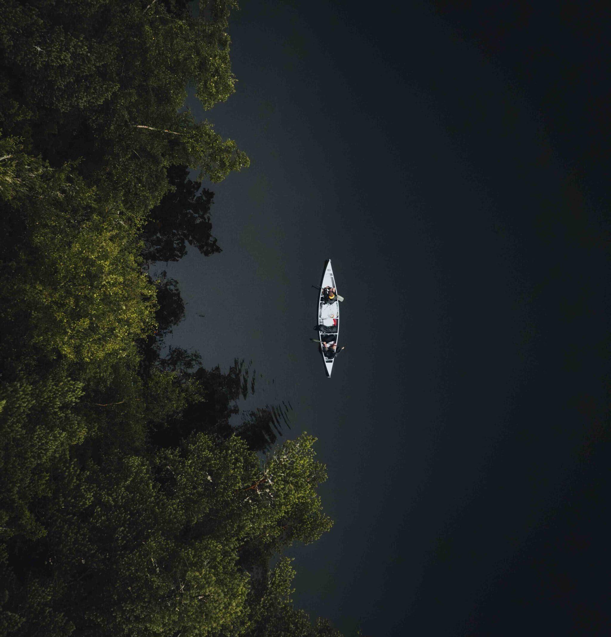 lake in sweden with a canoe in the middle